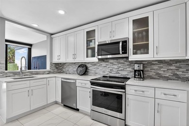 Rarely available two-bedroom, two-bath villa in the Peppertree on Boca West Golf and Country Club in Florida - for sale on GolfHomes.com, golf home, golf lot