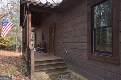 Nestled in the serene beauty of the North Georgia mountains on White Path Golf Club in Georgia - for sale on GolfHomes.com, golf home, golf lot