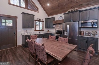 Nestled in the serene beauty of the North Georgia mountains on White Path Golf Club in Georgia - for sale on GolfHomes.com, golf home, golf lot