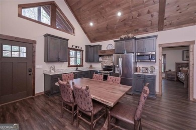 Nestled in the serene beauty of the North Georgia mountains on White Path Golf Club in Georgia - for sale on GolfHomes.com, golf home, golf lot