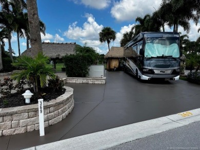 This beautifully landscaped tiki lot offers breathtaking sunset on Motorcoach Resort Golf Course in Florida - for sale on GolfHomes.com, golf home, golf lot