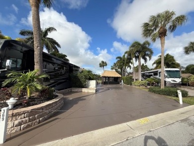 This beautifully landscaped tiki lot offers breathtaking sunset on Motorcoach Resort Golf Course in Florida - for sale on GolfHomes.com, golf home, golf lot