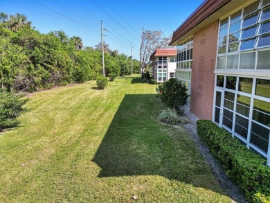 Ultra clean, nicely furnished 2BR/2BA condo tucked into the NW on The American Golf Club in Florida - for sale on GolfHomes.com, golf home, golf lot