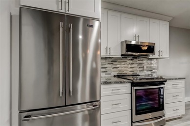 WELCOME HOME to this beautifully updated Open and Spacious villa on Seminole Lake Country Club in Florida - for sale on GolfHomes.com, golf home, golf lot