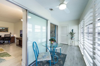 Enjoy tranquil golf course views and contemporary coastal style on Royal Palm Golf Club in Florida - for sale on GolfHomes.com, golf home, golf lot