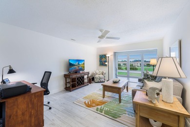 Enjoy tranquil golf course views and contemporary coastal style on Royal Palm Golf Club in Florida - for sale on GolfHomes.com, golf home, golf lot