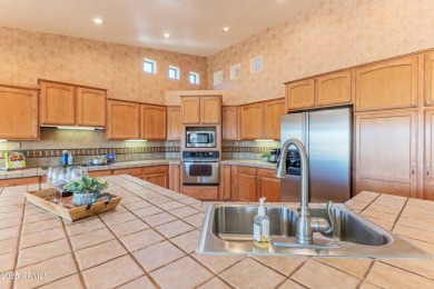 STUNNING VIEWS! Enjoy golf, lake, & mountain views from the on Tuscany Falls At Pebble Creek in Arizona - for sale on GolfHomes.com, golf home, golf lot