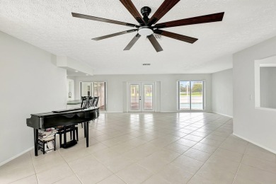 Panoramic golf and lake views abound at this Sandpiper Bay gem! on The Saints At Port St Lucie Golf Course in Florida - for sale on GolfHomes.com, golf home, golf lot