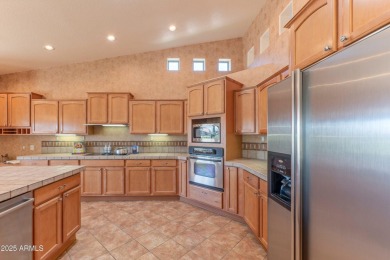 STUNNING VIEWS! Enjoy golf, lake, & mountain views from the on Tuscany Falls At Pebble Creek in Arizona - for sale on GolfHomes.com, golf home, golf lot