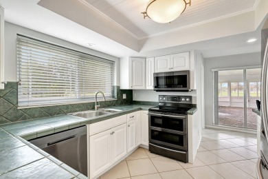 Panoramic golf and lake views abound at this Sandpiper Bay gem! on The Saints At Port St Lucie Golf Course in Florida - for sale on GolfHomes.com, golf home, golf lot