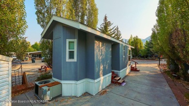 Discover a charming park model in the heart of Star Valley Ranch on Star Valley RV Golf Course in Wyoming - for sale on GolfHomes.com, golf home, golf lot