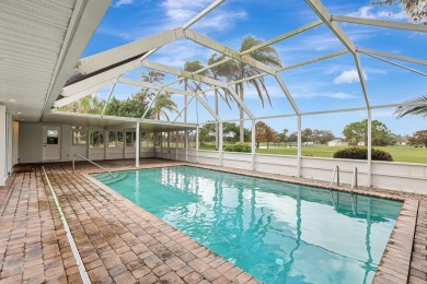 Panoramic golf and lake views abound at this Sandpiper Bay gem! on The Saints At Port St Lucie Golf Course in Florida - for sale on GolfHomes.com, golf home, golf lot