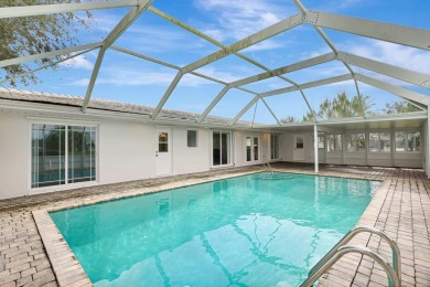 Panoramic golf and lake views abound at this Sandpiper Bay gem! on The Saints At Port St Lucie Golf Course in Florida - for sale on GolfHomes.com, golf home, golf lot