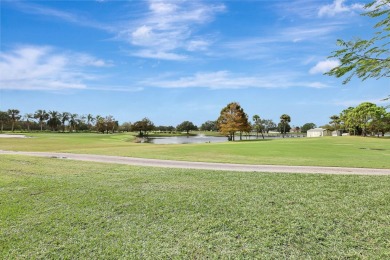 Panoramic golf and lake views abound at this Sandpiper Bay gem! on The Saints At Port St Lucie Golf Course in Florida - for sale on GolfHomes.com, golf home, golf lot