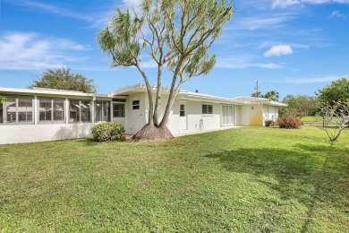 Panoramic golf and lake views abound at this Sandpiper Bay gem! on The Saints At Port St Lucie Golf Course in Florida - for sale on GolfHomes.com, golf home, golf lot