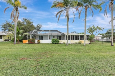 Panoramic golf and lake views abound at this Sandpiper Bay gem! on The Saints At Port St Lucie Golf Course in Florida - for sale on GolfHomes.com, golf home, golf lot