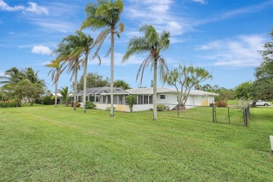 Panoramic golf and lake views abound at this Sandpiper Bay gem! on The Saints At Port St Lucie Golf Course in Florida - for sale on GolfHomes.com, golf home, golf lot