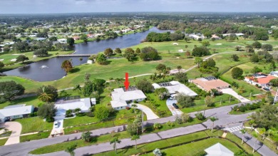 Panoramic golf and lake views abound at this Sandpiper Bay gem! on The Saints At Port St Lucie Golf Course in Florida - for sale on GolfHomes.com, golf home, golf lot