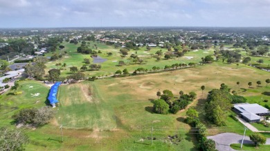 Panoramic golf and lake views abound at this Sandpiper Bay gem! on The Saints At Port St Lucie Golf Course in Florida - for sale on GolfHomes.com, golf home, golf lot