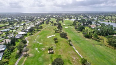 Panoramic golf and lake views abound at this Sandpiper Bay gem! on The Saints At Port St Lucie Golf Course in Florida - for sale on GolfHomes.com, golf home, golf lot