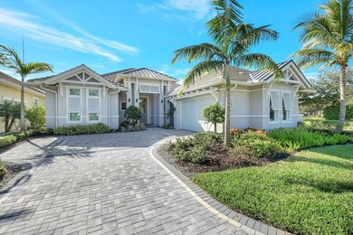 This stunning single-story residence, built in 2023, showcases on The Golf Club At Fiddlers Creek in Florida - for sale on GolfHomes.com, golf home, golf lot