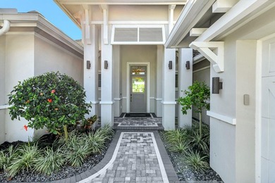 This stunning single-story residence, built in 2023, showcases on The Golf Club At Fiddlers Creek in Florida - for sale on GolfHomes.com, golf home, golf lot