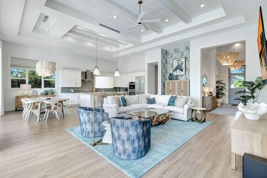 This stunning single-story residence, built in 2023, showcases on The Golf Club At Fiddlers Creek in Florida - for sale on GolfHomes.com, golf home, golf lot