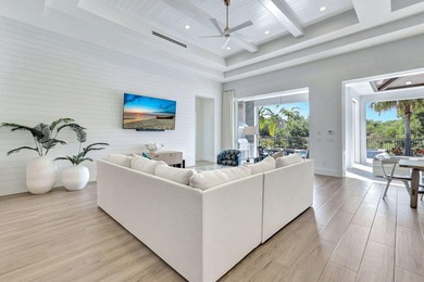 This stunning single-story residence, built in 2023, showcases on The Golf Club At Fiddlers Creek in Florida - for sale on GolfHomes.com, golf home, golf lot