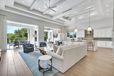 This stunning single-story residence, built in 2023, showcases on The Golf Club At Fiddlers Creek in Florida - for sale on GolfHomes.com, golf home, golf lot