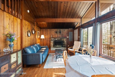 Let the outside in with this beautiful original Lake Naomi cabin on Lake Naomi Timber Trails Golf Club in Pennsylvania - for sale on GolfHomes.com, golf home, golf lot