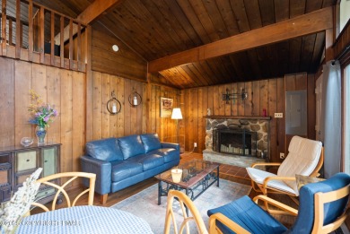 Let the outside in with this beautiful original Lake Naomi cabin on Lake Naomi Timber Trails Golf Club in Pennsylvania - for sale on GolfHomes.com, golf home, golf lot