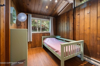 Let the outside in with this beautiful original Lake Naomi cabin on Lake Naomi Timber Trails Golf Club in Pennsylvania - for sale on GolfHomes.com, golf home, golf lot