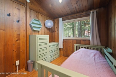 Let the outside in with this beautiful original Lake Naomi cabin on Lake Naomi Timber Trails Golf Club in Pennsylvania - for sale on GolfHomes.com, golf home, golf lot