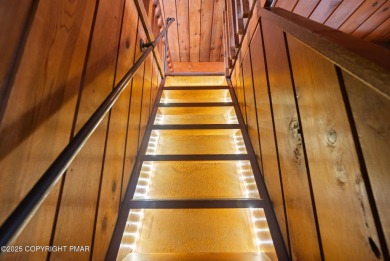 Let the outside in with this beautiful original Lake Naomi cabin on Lake Naomi Timber Trails Golf Club in Pennsylvania - for sale on GolfHomes.com, golf home, golf lot