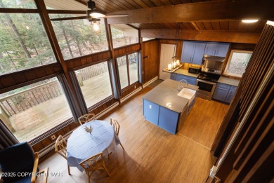 Let the outside in with this beautiful original Lake Naomi cabin on Lake Naomi Timber Trails Golf Club in Pennsylvania - for sale on GolfHomes.com, golf home, golf lot