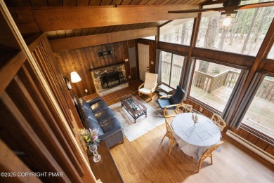 Let the outside in with this beautiful original Lake Naomi cabin on Lake Naomi Timber Trails Golf Club in Pennsylvania - for sale on GolfHomes.com, golf home, golf lot