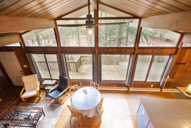 Let the outside in with this beautiful original Lake Naomi cabin on Lake Naomi Timber Trails Golf Club in Pennsylvania - for sale on GolfHomes.com, golf home, golf lot