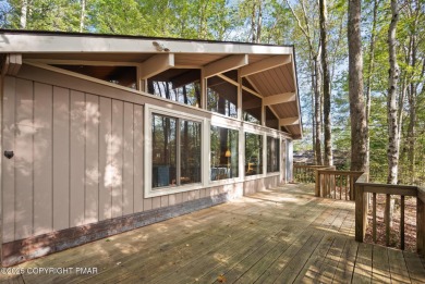 Let the outside in with this beautiful original Lake Naomi cabin on Lake Naomi Timber Trails Golf Club in Pennsylvania - for sale on GolfHomes.com, golf home, golf lot