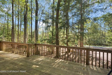 Let the outside in with this beautiful original Lake Naomi cabin on Lake Naomi Timber Trails Golf Club in Pennsylvania - for sale on GolfHomes.com, golf home, golf lot