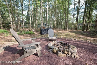 Let the outside in with this beautiful original Lake Naomi cabin on Lake Naomi Timber Trails Golf Club in Pennsylvania - for sale on GolfHomes.com, golf home, golf lot