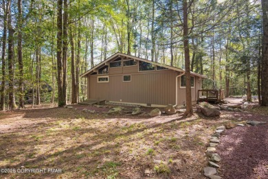 Let the outside in with this beautiful original Lake Naomi cabin on Lake Naomi Timber Trails Golf Club in Pennsylvania - for sale on GolfHomes.com, golf home, golf lot