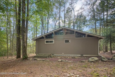 Let the outside in with this beautiful original Lake Naomi cabin on Lake Naomi Timber Trails Golf Club in Pennsylvania - for sale on GolfHomes.com, golf home, golf lot