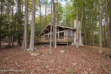Let the outside in with this beautiful original Lake Naomi cabin on Lake Naomi Timber Trails Golf Club in Pennsylvania - for sale on GolfHomes.com, golf home, golf lot