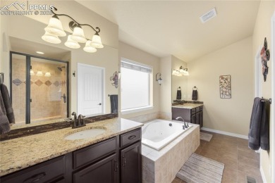 This stunning home offers four bedrooms and three bathrooms with on The Club At Flying Horse in Colorado - for sale on GolfHomes.com, golf home, golf lot
