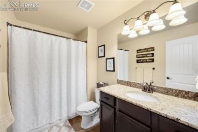 This stunning home offers four bedrooms and three bathrooms with on The Club At Flying Horse in Colorado - for sale on GolfHomes.com, golf home, golf lot