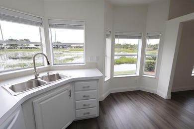 2-YEAR HOME WARRANTY OFFERED AT THE LIST PRICE! Waterfront on Savanna Golf Club in Florida - for sale on GolfHomes.com, golf home, golf lot