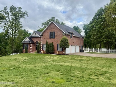 Executive Style Brick Home with 5 Beds, 4.5 Baths, 3 car garage on Neosho Municipal Golf Course in Missouri - for sale on GolfHomes.com, golf home, golf lot