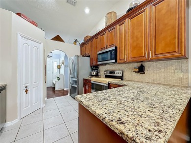 Welcome to this well-maintained 3-bedroom, 2-bath pool home on a on The Grand Club Cypress Course in Florida - for sale on GolfHomes.com, golf home, golf lot