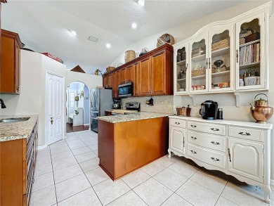 Welcome to this well-maintained 3-bedroom, 2-bath pool home on a on The Grand Club Cypress Course in Florida - for sale on GolfHomes.com, golf home, golf lot