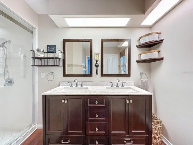 Welcome to this well-maintained 3-bedroom, 2-bath pool home on a on The Grand Club Cypress Course in Florida - for sale on GolfHomes.com, golf home, golf lot